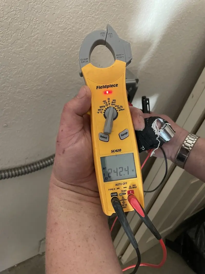 Voltage testing with clamp meter during Electrical Installation Services in Wellington